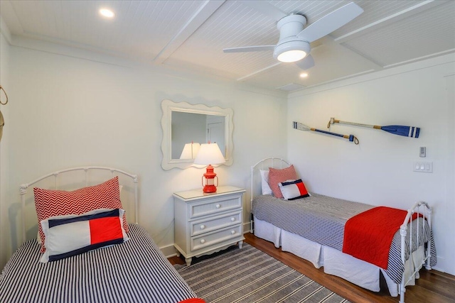 bedroom with ceiling fan, crown molding, and dark hardwood / wood-style floors