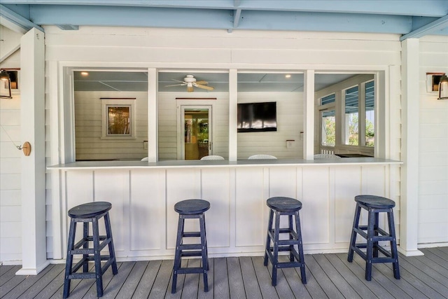 exterior space with hardwood / wood-style flooring and ceiling fan