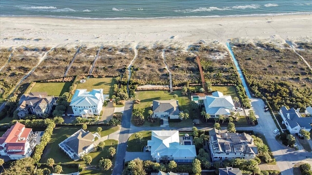 bird's eye view featuring a beach view and a water view