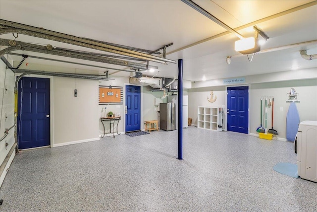 garage featuring washer / clothes dryer and a garage door opener