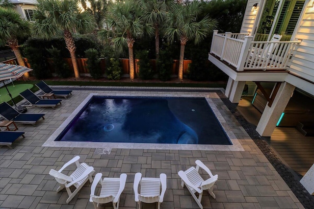 view of pool featuring a hot tub and a patio