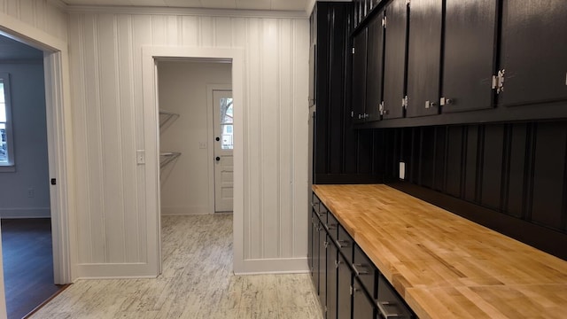 interior space with light hardwood / wood-style floors and ornamental molding