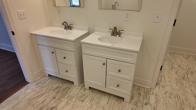 bathroom with hardwood / wood-style flooring and vanity