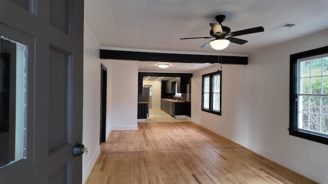 hall featuring a wealth of natural light and light wood-type flooring