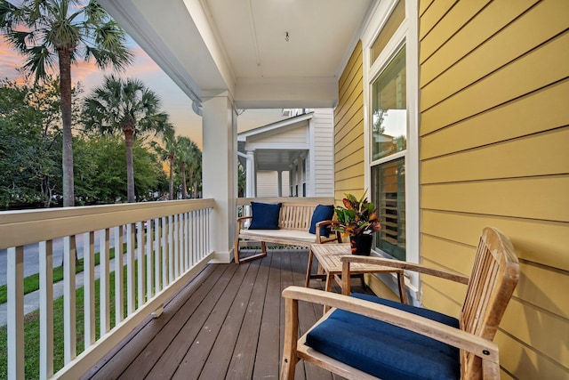 deck at dusk with a porch