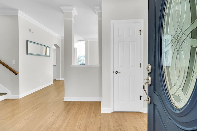 entrance foyer with light wood-type flooring and crown molding