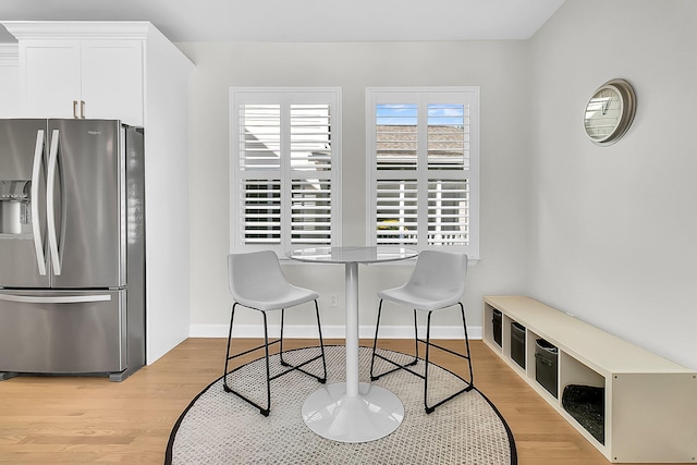 dining area with light wood-type flooring