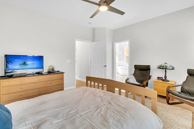 bedroom with ceiling fan and connected bathroom