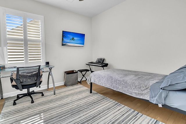 bedroom with hardwood / wood-style floors