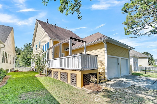 view of home's exterior featuring a garage and a lawn