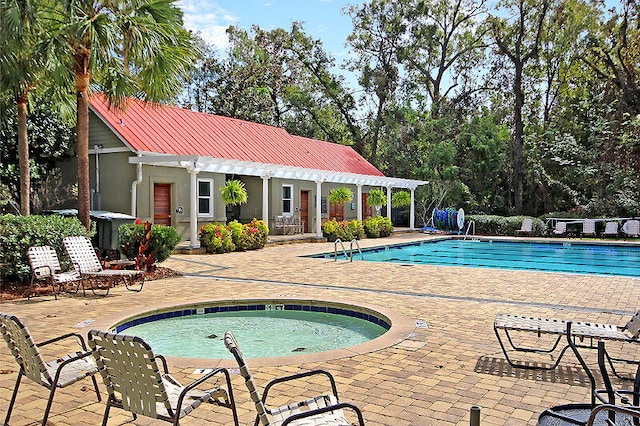 view of swimming pool with a pergola, a patio, and an outdoor structure