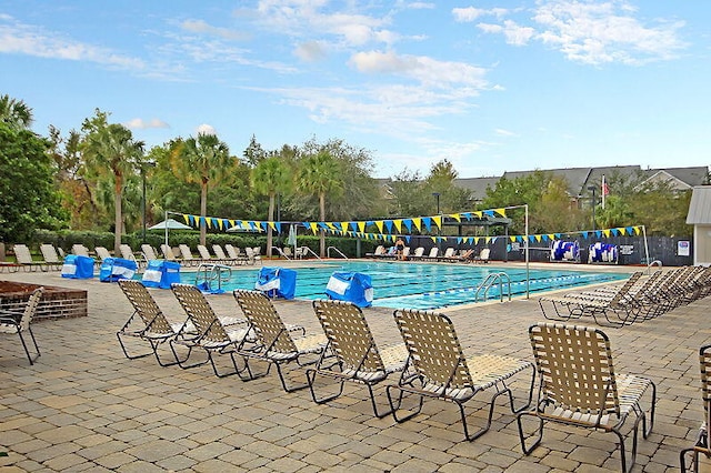 view of swimming pool featuring a patio