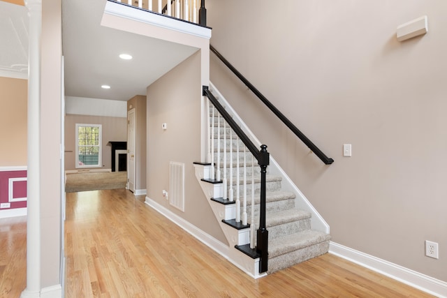 stairway featuring wood-type flooring