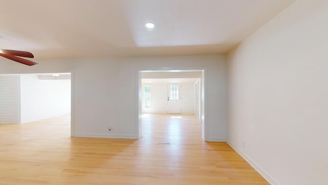 unfurnished room with ceiling fan and light hardwood / wood-style floors