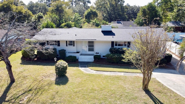 ranch-style home with a front yard