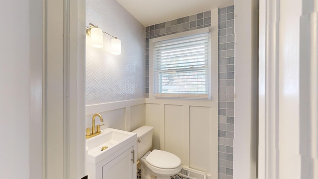 bathroom featuring vanity and toilet