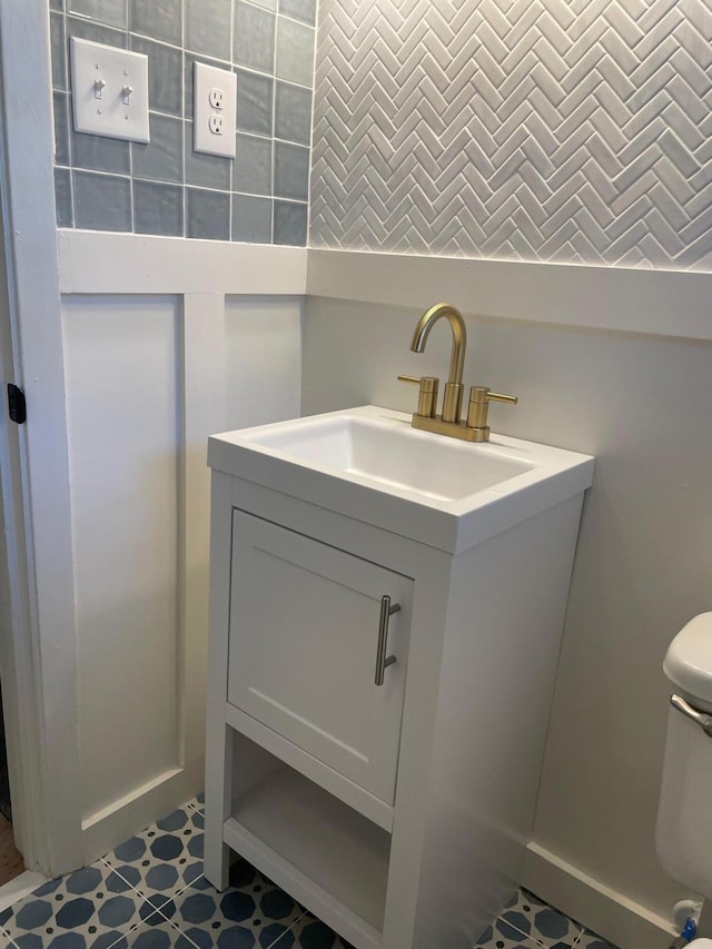 bathroom with vanity and toilet