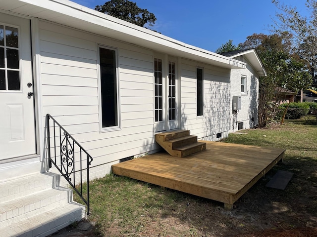 view of home's exterior featuring a wooden deck