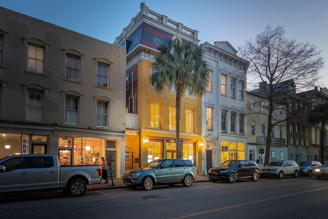 view of outdoor building at dusk