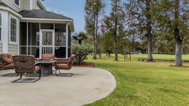 view of patio featuring a fire pit and a sunroom