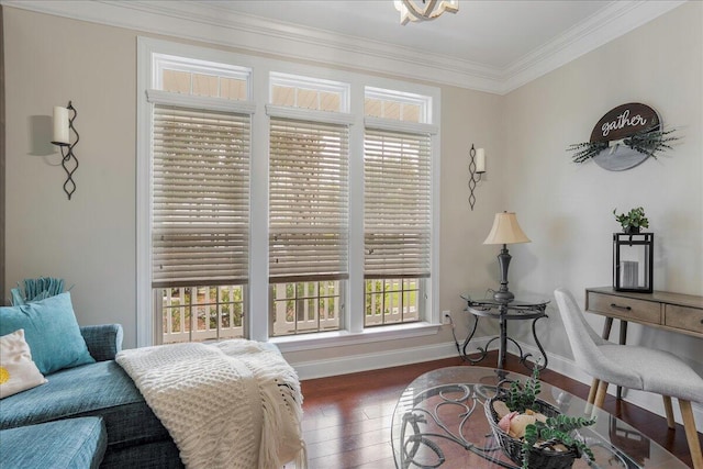 sitting room with ornamental molding, plenty of natural light, and dark hardwood / wood-style flooring