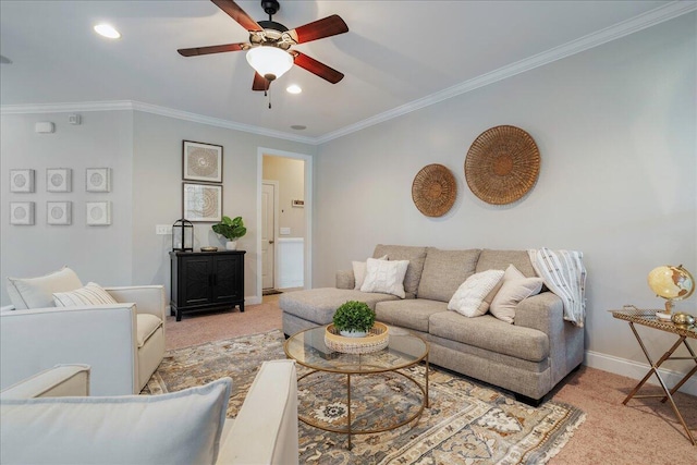 living room with ceiling fan, crown molding, and light carpet