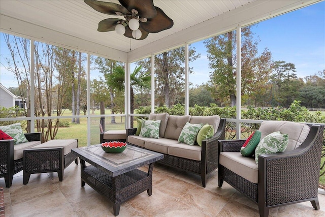 sunroom / solarium featuring ceiling fan