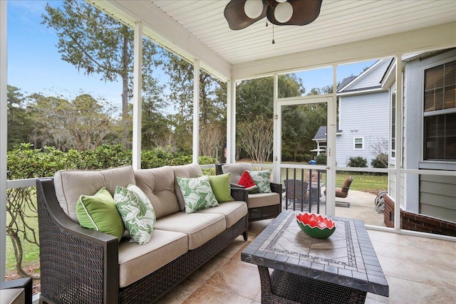 sunroom / solarium with ceiling fan