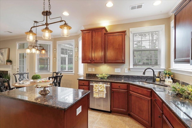 kitchen with a center island, decorative light fixtures, a healthy amount of sunlight, sink, and stainless steel dishwasher