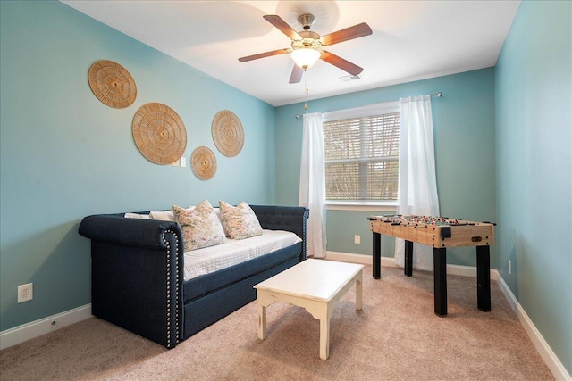 living room featuring ceiling fan and light carpet