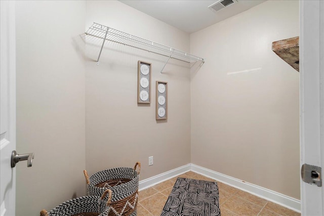 laundry room with light tile patterned flooring