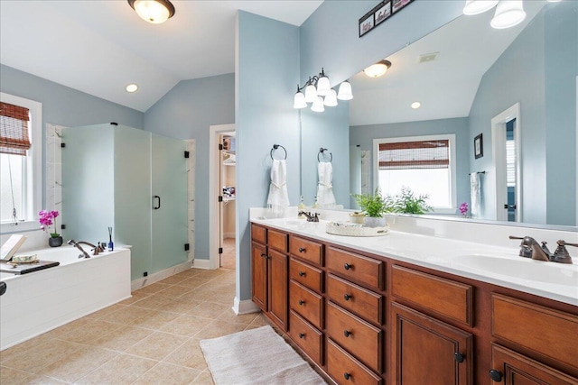 bathroom featuring tile patterned floors, shower with separate bathtub, vanity, and vaulted ceiling