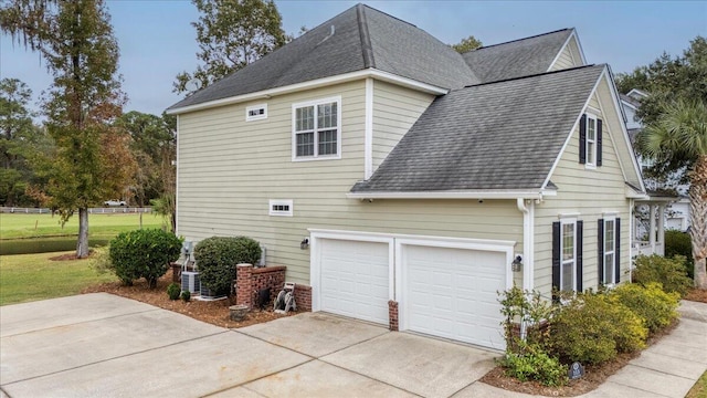 view of side of home featuring a garage