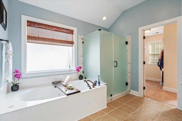 bathroom featuring shower with separate bathtub, tile patterned flooring, and lofted ceiling