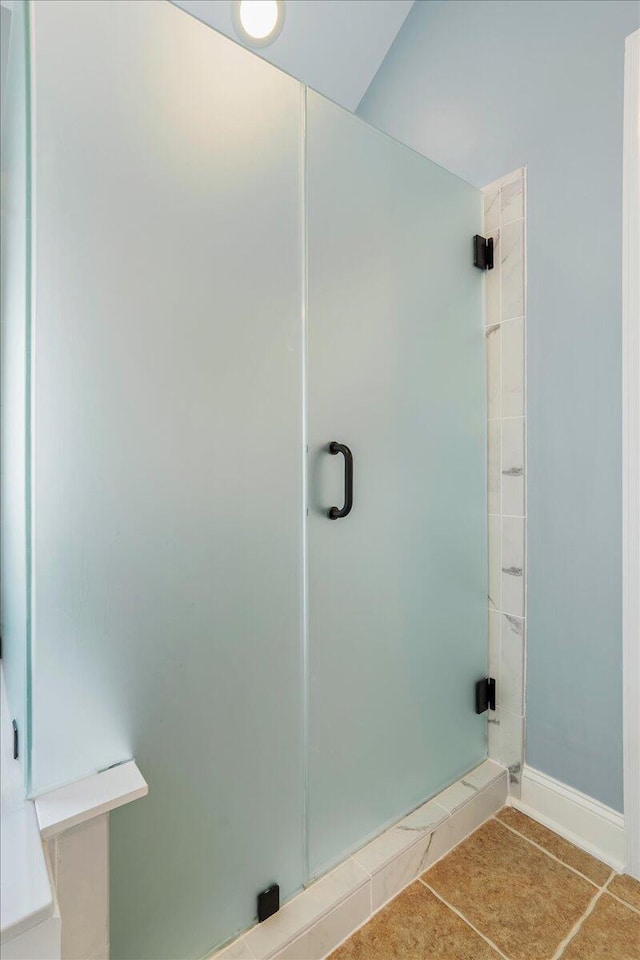 bathroom featuring tile patterned floors and walk in shower