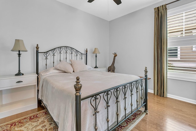 bedroom with ceiling fan and light hardwood / wood-style flooring