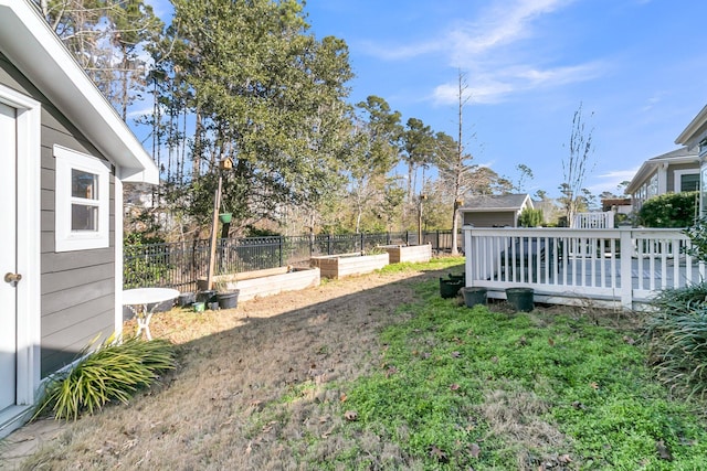 view of yard featuring a wooden deck