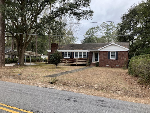 view of front of property with a carport