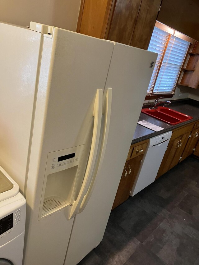 kitchen with white appliances and sink