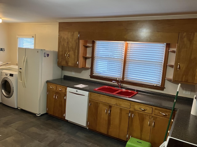 kitchen featuring crown molding, washer / dryer, white appliances, and sink