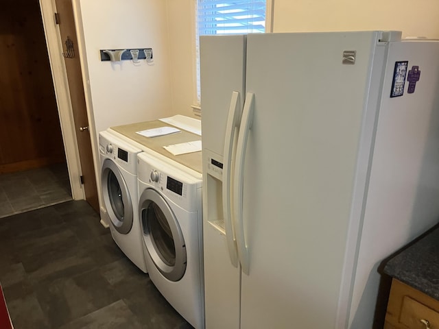 laundry room featuring washing machine and clothes dryer