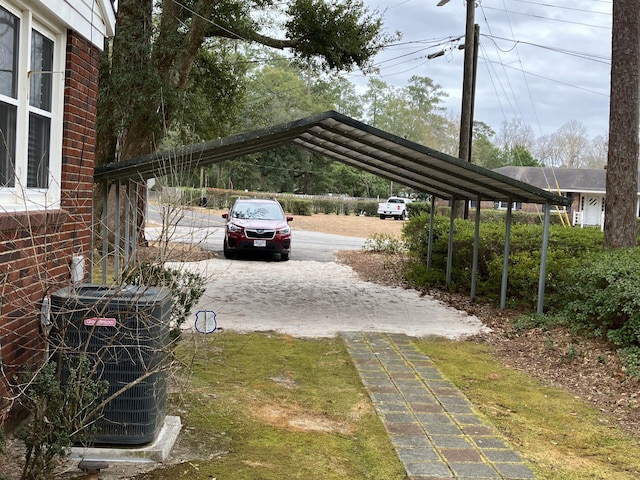 view of vehicle parking with a carport