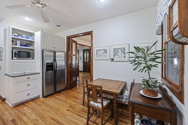 kitchen with ceiling fan, light wood-style flooring, open shelves, white cabinetry, and appliances with stainless steel finishes