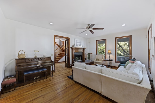living room featuring recessed lighting, ceiling fan, and wood finished floors