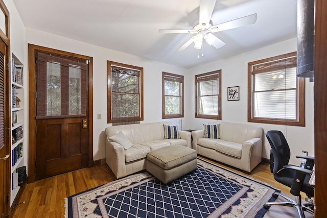 interior space featuring wood finished floors and a ceiling fan