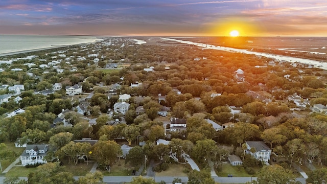 aerial view with a water view and a beach view
