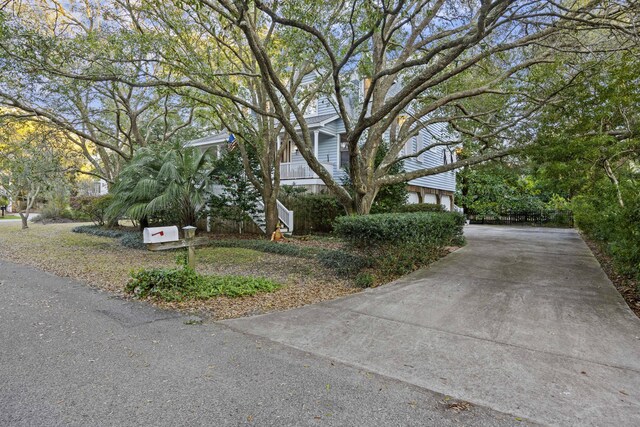 view of home's exterior featuring concrete driveway