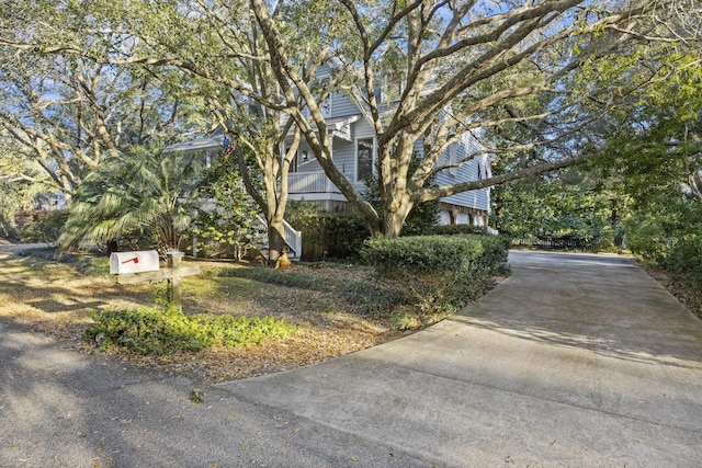 view of property exterior with concrete driveway