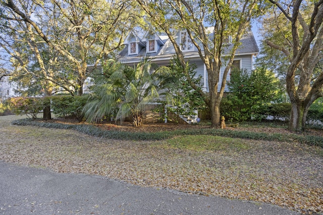 view of front of home featuring stairway