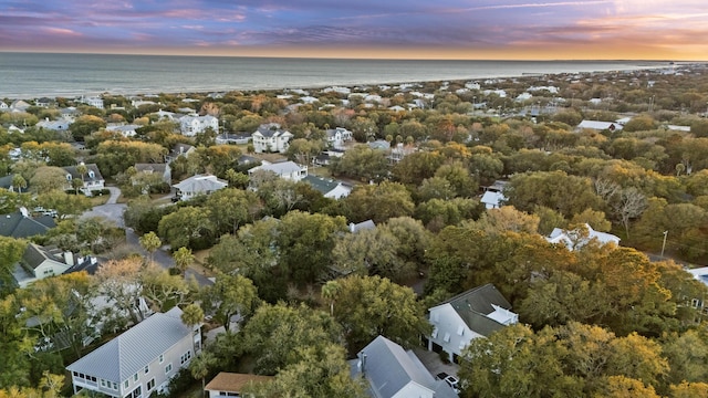 aerial view at dusk with a water view